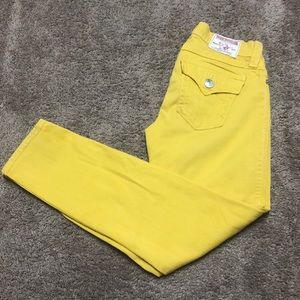 Yellow True Religion jeans.